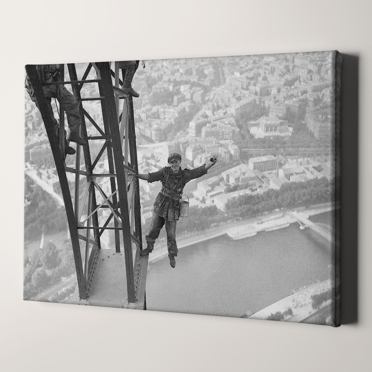 Worker Finishes Painting the Eiffel Tower