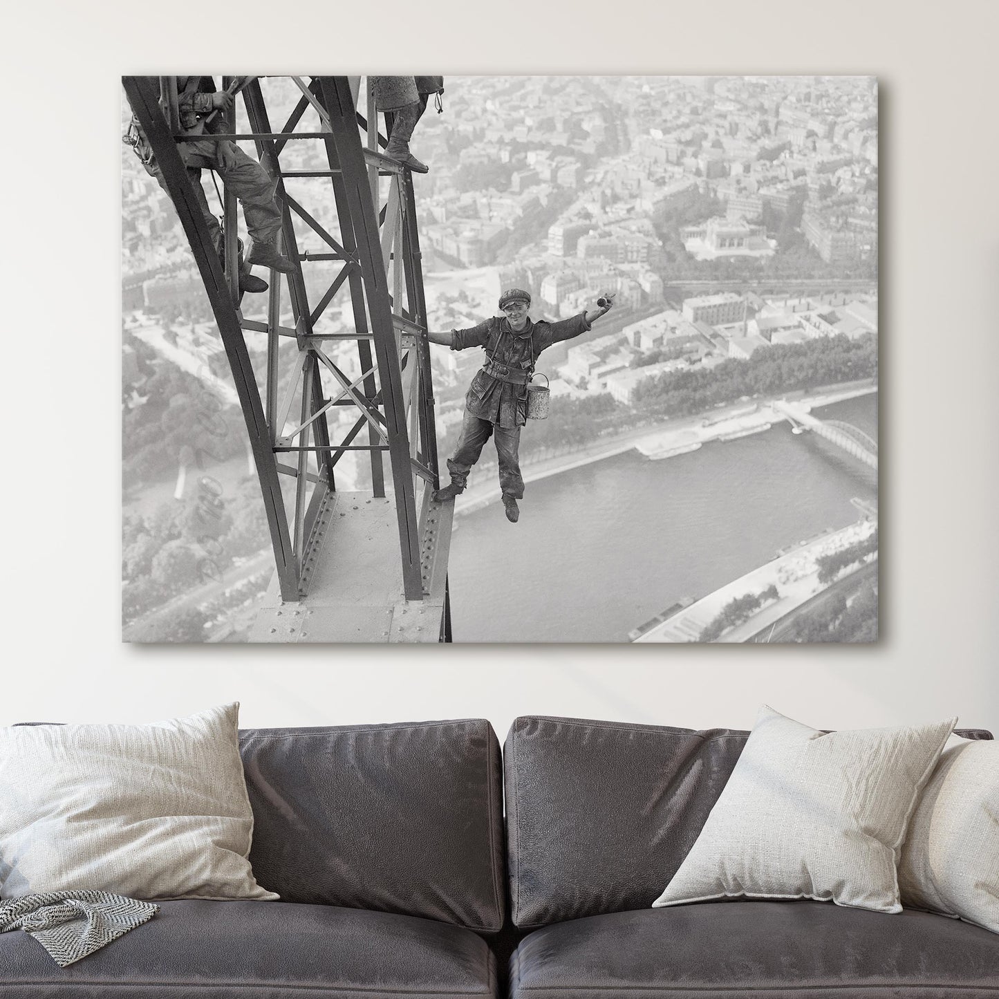 Worker Finishes Painting the Eiffel Tower