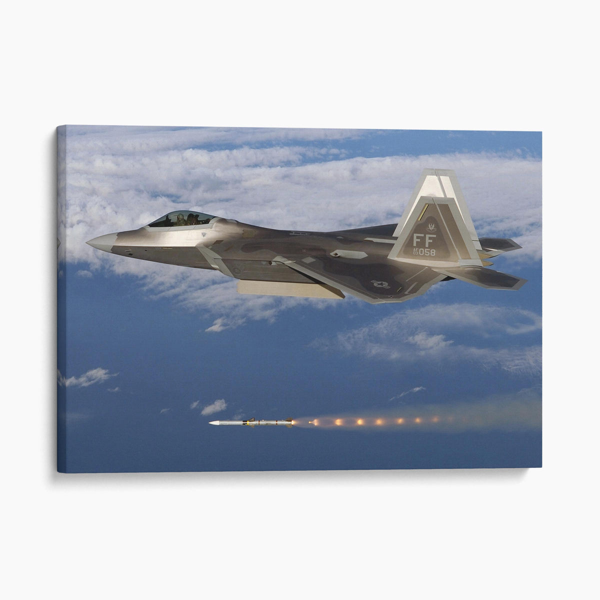 F-22 fires an AIM-120 AMRAAM missile