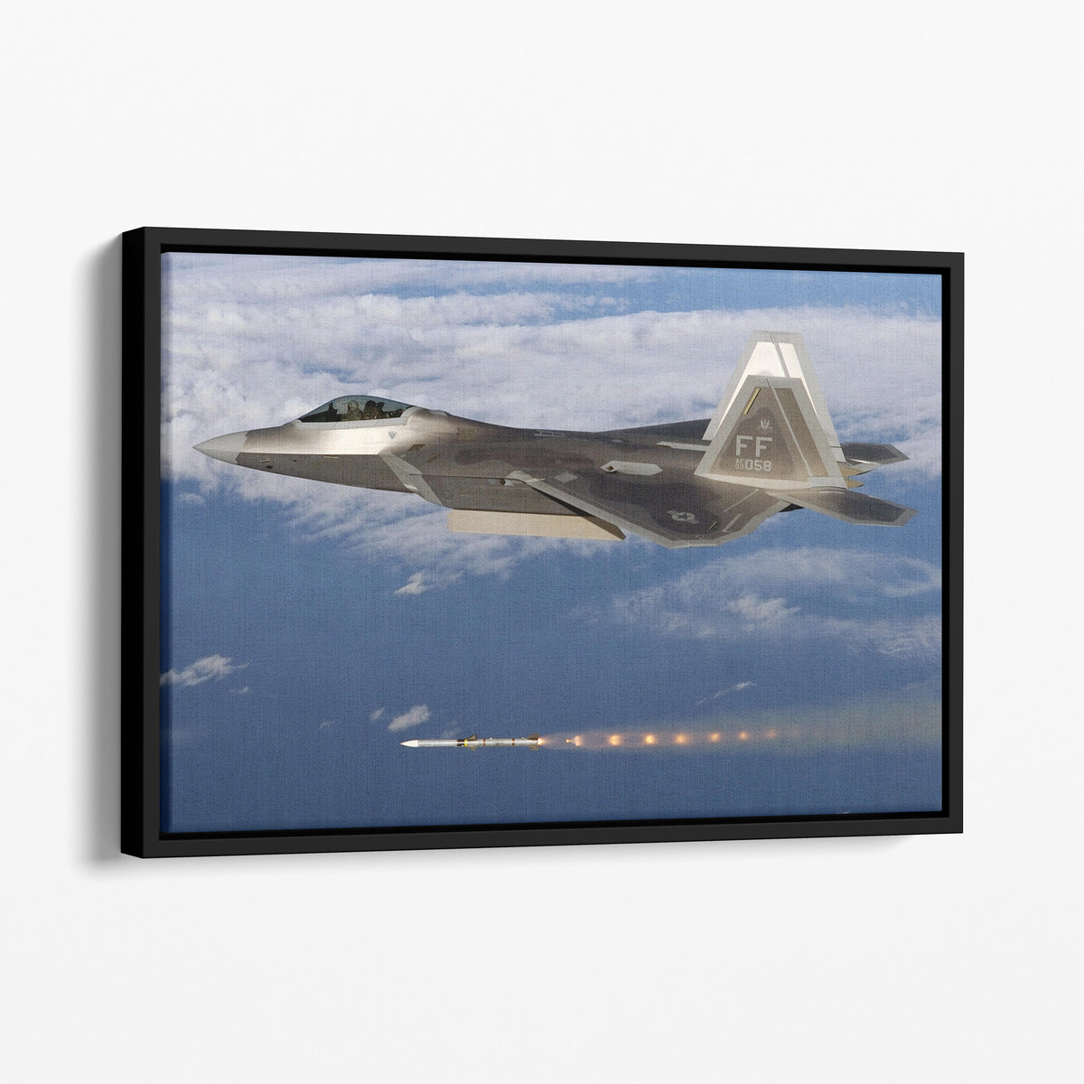 F-22 fires an AIM-120 AMRAAM missile